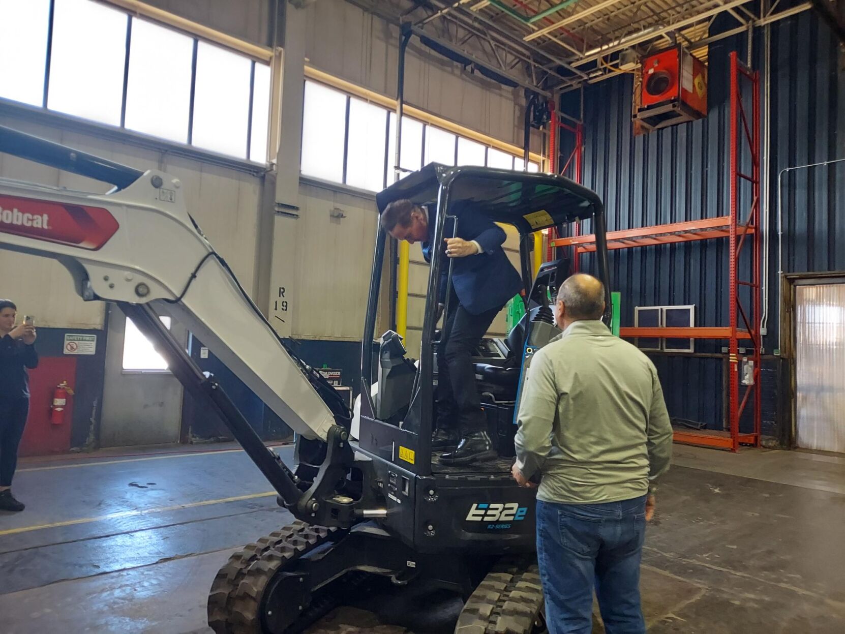 Viridi Parente-Higgins climbs on equipment